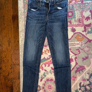 American eagle super super stretch dark wash jeans.